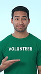 Face, man and volunteer with tshirt in studio for recruitment, invitation and social responsibility. Portrait, person or come gesture for participation, join us and call to action on white background