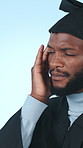 Headache, graduation and black man in studio with pain for university, college and academic stress. School, migraine and person with fatigue for education, learning and studying on blue background