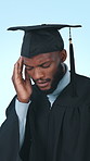 Headache, graduate and black man in studio with pain for university, college and academic stress. School, migraine and person with fatigue for education, learning and studying on blue background