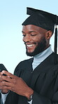 Graduation, phone and college with black man in studio for success, post and scholarship. University student, social media update and smile with person on blue background for ceremony and achievement