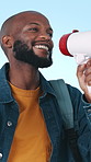 Smile, student and black man in studio, megaphone or political protest on blue background. Bullhorn, announcement or African person with communication, speech for social change or rally for education