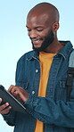 Student, man and research with tablet for education, happy and search for college scholarship on web. Studio, blue background and  black person with tech for university funding opportunity and scroll