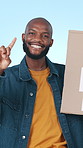 Face, unity and black man in studio, sign and poster for motivation on blue background. African person, volunteer and cardboard for community service, we stand together and support for campaign