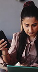 Woman, phone and tablet for remote work at cafe with review, scroll and insight for editing article. Person, freelance writer and smartphone with laptop, report or feedback for project at coffee shop