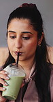 Matcha, smile and Indian woman in office with drinking, green tea and antioxidant benefit in organic cup. Detox, refreshment or employee with beverage, gut health or immune support in wellness mix.