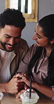 Couple, holding hands and laugh with milkshake at restaurant with connection, love and bonding. Man, woman and partner on date for drinks with relationship, smile or trust with loyalty at coffee shop