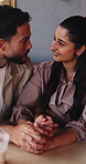 Happy, couple and holding hands in cafe with love, connection and bonding together on weekend date. Married people, laugh and conversation in restaurant with trust, romantic and healthy relationship.