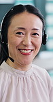 Face, Asian woman and smile with headset at call centre for career pride, contact us and customer service. Portrait, mature person and agent for technical support, crm assistance and agency in Japan