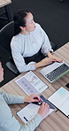 Above, business and Asian people in discussion with documents for finance review, proposal and strategy. Corporate, meeting and workers on laptop for financial portfolio, research and budget planning