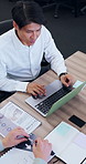 Above, laptop and business people in meeting with documents for finance review, proposal and strategy. Corporate, talking and workers on computer for financial portfolio, research and budget planning