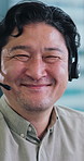 Face, Asian man and happy with headset at call centre for career pride, contact us or customer service. Portrait, mature person and agent for technical support, crm representative and agency in Japan