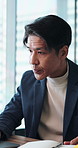 Notebook, reading and proposal with businessman in office for administration, report or research. Accountant, laptop and problem solving with person for financial management, typing or audit in Japan