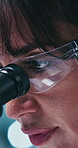Science, goggles or woman in clinic with microscope, study or investigation in vaccine development. Medical, glasses or scientist in lab with equipment, research or inspection in pharmaceutical trial