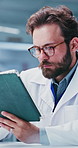 Man, scientist and reading with tablet in lab for research, test results and experiment report. Person, review or digital for medical progress, healthcare study and information on vaccine development