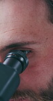 Science, test or man in lab with microscope, study or examination in vaccine development. Medical, analysis or scientist in clinic with equipment, research or investigation in pharmaceutical trial.