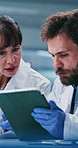 Scientist, team and planning with tablet at laboratory with checklist, notes and medical research. Woman, man and collaboration with tech, application and pharmaceutical study for vaccine development