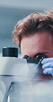 Scientist, man and project in lab with microscope, experiment and test sample for medical research. Bokeh, person and science investigation in clinic with healthcare study, biotech and inspection.