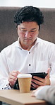 Business, pen and tablet with Japanese man in office for accounting, budget or finance review. App, report and schedule with mature employee in financial workplace for agenda, development or planning