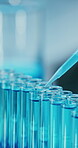 Science, dropper and chemical in test tubes in lab for enzyme analysis, cell culture or innovation. Medical research, liquid and vial samples in containers for biological staining, study and closeup