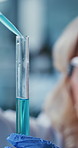 Test tube, analysis and scientist with pipette in lab, exam or medical research for drug development. Clinic, biotech and mature woman with eyewear for safety, pharmaceutical and study with chemical