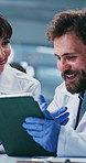 Happy, people and scientist with tablet in lab for research, test results and experiment report. Team, talking and digital for medical trial, healthcare study and information for vaccine development