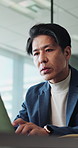 Laptop, typing and Asian man in office with research, creative idea and plan for digital marketing. Mature person, browse and reading with computer, website or report for online advertising in Japan.