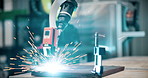 Robot, welding and empty at warehouse for manufacturing with sparks, material and process at industry plant. Machine, tools and robotics with automated workflow for efficiency at futuristic factory