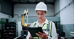 Engineer, robotics and woman on tablet in facility for assembly line, software update and inspection. Automation, online and person on digital tech for system diagnostics, design or technical manual