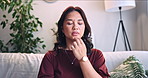 Breathe, relax and woman with eft tapping on sofa for anxiety, mental health and holistic healing. Life coach, calm and Asian female person with spiritual energy for reiki treatment or zen in home