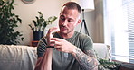 Therapy, hands and man with eft tapping in home for balance, mental health and holistic healing. Psychology, calm and male person with acupressure for reiki treatment, anxiety or zen in house