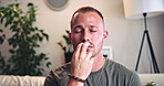 Breathe, relax and man with eft tapping on sofa for anxiety, mental health and holistic healing. Psychology, calm and male person with spiritual energy for reiki treatment, therapy or zen in home