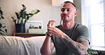 Psychology, relax and man with eft tapping on sofa for anxiety, mental health and holistic healing. Therapy, calm and male person with spiritual energy for reiki treatment, breathe or zen in home