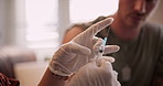 Nurse, hands or injection with needle in home for vaccination, medical cure or remedy. Doctor, client or patient with surgical cloves or syringe for vaccine, health checkup or treatment in house