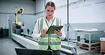Woman, engineer and reading with tablet at warehouse for research, machine update and technical guide. Person, digital or production manual, automation safety and diagnostics report for manufacturing