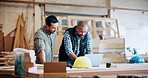 Discussion, carpenter and men with laptop in warehouse for inventory, meeting or furniture production. Woodworking, people and online update for timber supply, lumber and construction business