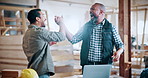 Excited, carpenter and men with high five in warehouse for deal, success or furniture production. Woodworking, people and celebration for timber collaboration, lumber and approval for construction
