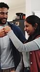 Home, fist bump and couple with smile, renovation and bonding together with property interior. Man, woman and house with agreement, hand gesture and planning with design, maintenance or construction