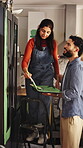 Help, couple and painting cupboard in kitchen for home upgrade, renovation or creative planning. Interior design, people and happy with paintbrush for DIY makeover, house improvement or decor support