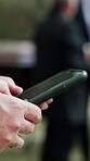 Funeral, typing and hands outdoor with phone, family arrangements or update on reception details. Digital, bokeh and person outside with tech, ceremony agenda or online chat at memorial service.