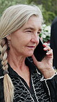 Funeral, phone call or old woman outdoor with chat, arrangements or update on reception details. Digital, connection or senior person with tech, ceremony agenda or online contact at memorial service.