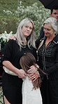 Grandparent, mom or daughter at funeral with hug, support or remembrance with mourning. Emotional, women or child in cemetary with embrace, family comfort or shared grief at memorial service.
