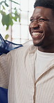 Celebration, France flag and streaming with black man on sofa in home as soccer or sports fan. Cheering, motivation and shouting with French supporter in apartment living room for success or victory
