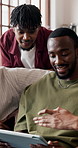 Friends, tablet and watch sport in house with conversation, bonding together or football entertainment. People, discussion and live stream in lounge with tech, soccer game and chill on weekend break.
