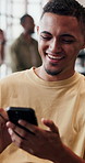 Phone, relax and man in home with funny message, social media or reading notification on internet. Mobile, laugh and person in living room with meme on app, text or typing for online communication