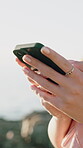 Tourism, outdoor and hands typing with phone, message app and travel holiday update for social media. Nature, space and woman with mobile for online communication, texting and summer vacation post