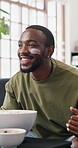 Man, cheering and watching tv in home with sports, popcorn and goal for football competition success. Happy, black person and eating snack in house with soccer world cup win, celebration or USA flag.