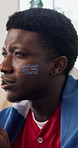 Disappointed, flag or black man in house with soccer game, match loss or worry in tournament. Frustrated, watching competition or football fan with anxiety, score mistake or event results in England.
