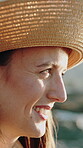 Travel, thinking and happy woman with hat at beach for summer holiday, nature tourism or sightseeing. Vacation, relax or tourist with reflection at ocean for weekend trip, explore island or fresh air