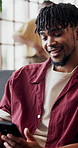 Phone, relax and man in home for internet, social media or check notification on forum. Mobile, reading and person in living room with app, text or scroll for online communication on platform