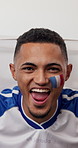 Face paint, watching tv and man with celebration for soccer in home, match success or sports goal. Portrait, television or excited fan with win for game, football competition and French flag with POV